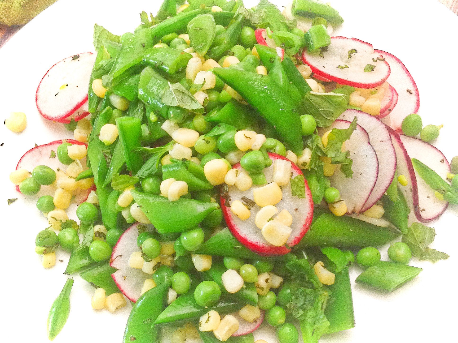 fresh-sugar-snap-pea-salad-with-radish-corn-and-mint-plants-rule